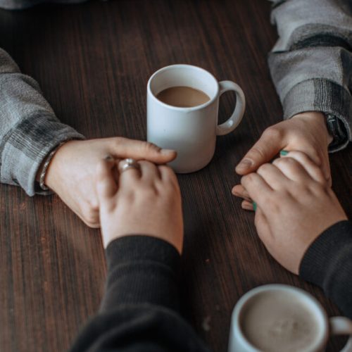 Holding hands to pray